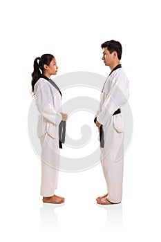 Two martial art practitioners facing each others, full body