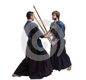 Two martial arts kendo fighters fighting, isolated on white background, two kendo fighters facing each other