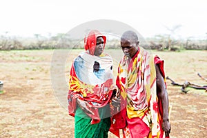 Two Massai men walking together