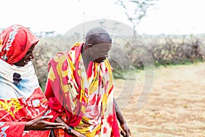 Two Massai men walking together