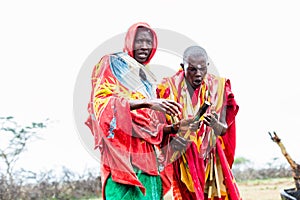 Two Massai men walking together photo