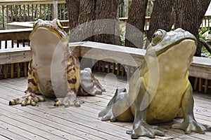 Two Massive Frog Statues on Boardwalk