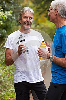 Two Mature Male Joggers Taking Break Whilst On Run