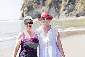 Two mature senior woman on the beach