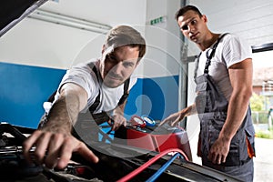 Two mechanic works together photo