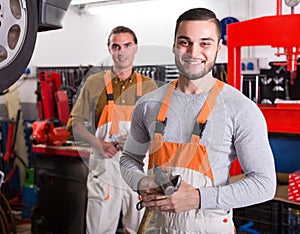 Two mechanics in workshop