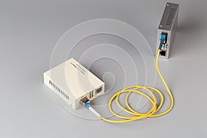Two media converters connected by fiber cable