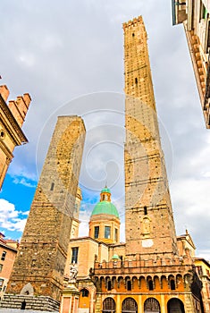 Two medieval towers of Bologna Le Due Torri: Asinelli and Garisenda and Chiesa di San Bartolomeo Gaetano church photo