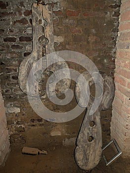 Two medieval wooden torture pillories.