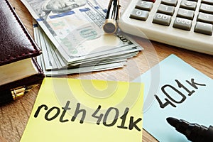 Two memo sticks roth 401k on a desk. Retirement.