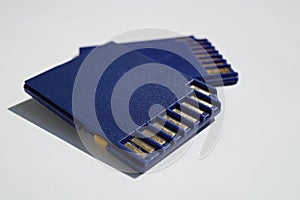 Two memory cards (SD card - Secure Digital card) used in video cameras and computers in blue color