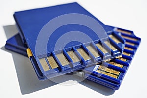 Two memory cards (SD card - Secure Digital card) used in video cameras and computers in blue color