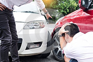 Two men arguing after a car accident Traffic Collision on the road.