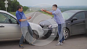 Two men arguing conflict after a car accident on the road car insurance lifestyle. slow motion video. Two Drivers man