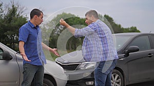 Two men arguing conflict after a car accident on the road car insurance. slow motion video. Two Drivers lifestyle man