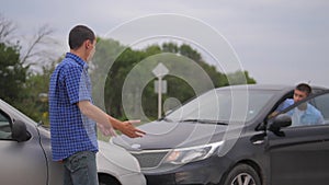 Two men arguing conflict after a car accident on the road car insurance. slow motion video. Two Drivers man Arguing