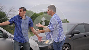 Two men arguing conflict after a car accident on the road car insurance. slow motion video. Two Drivers man Arguing