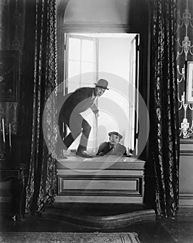 Two men breaking into an apartment