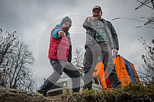 Two men camping outdoors