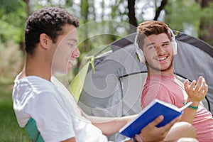two men camping outdoors