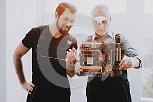 Two Men Checking Hardware Equipment from PC.