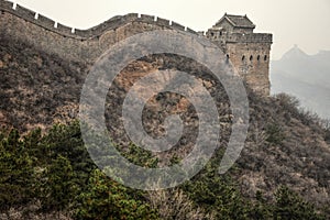 The two men climb the stairs on the Great Wall of China.