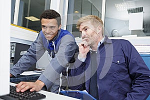 two men discussing work