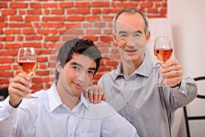 Two men drinking rose