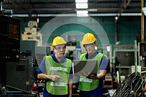 Two men engineer talking in modern factory