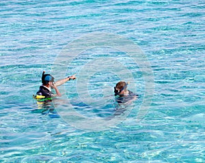 Two men in equipment for a snorkeling in