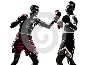 Two men exercising thai boxing silhouette