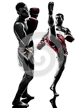Two men exercising thai boxing silhouette
