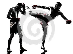 Two men exercising thai boxing silhouette