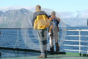 Two men on the ferry boat reaching the isle