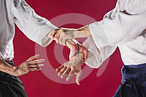 Two men fighting at Aikido training in martial arts school