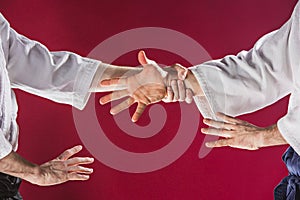 Two men fighting at Aikido training in martial arts school