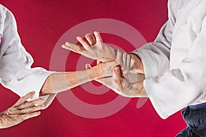 Two men fighting at Aikido training in martial arts school