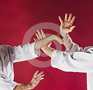 Two men fighting at Aikido training in martial arts school