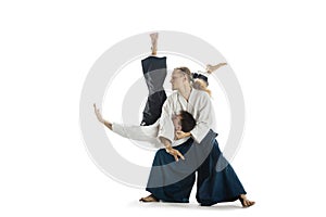 The two men fighting at Aikido training in martial arts school