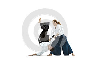 The two men fighting at Aikido training in martial arts school