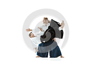 The two men fighting at Aikido training in martial arts school