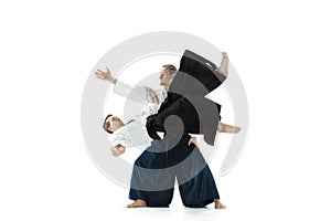 The two men fighting at Aikido training in martial arts school