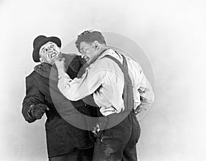 Two men fighting with each other