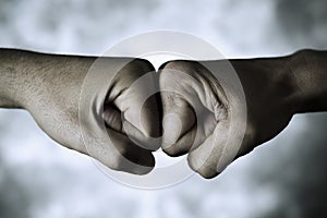 Two men fist bumping photo