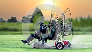 Two men flying and gliding in the air, Flying on paramotor, Preparation for flights on paramotors, Tandem paramotorgliding