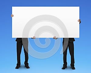 Two men holding blank board