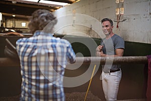 Two men interacting with each other while working