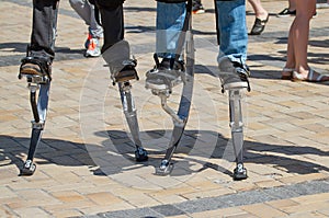 Two men on a jumping stilts