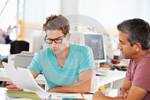 Two Men Meeting In Creative Office