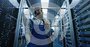 Two men performing maintenance in a data center